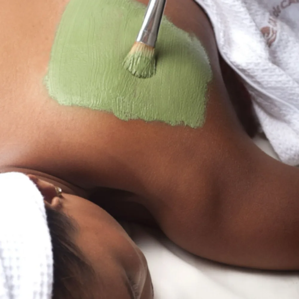 A treatment mask is being applied during a relaxing Bacial back treatment session.